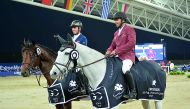 Qatar’s Bassem Hassan Mohammed (right) and France’s Julien Epaillard pose for photographs after the opening event of the LGCT final round at Al Shaqab Arena in Doha yesterday.