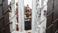 A girl who crossed the Canada-US border with her family claiming refugee status in Canada  at a temporary detention centre in Blackpool, Quebec on August 5, 2017. AFP/Geoff Robins