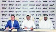 Abdulla Mubarak Al Khalifa (centre), Acting Chief Executive Officer at QNB Group;  IAAF President, Sebastian Coe (left), and Vice-President and Director General of the Local Organizing Committee and Vice-President of the IAAF,  Dahlan Al Hamad, at the sig