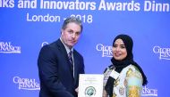Mashaal Al Derham (right), Head of Corporate Communications & Quality Assurance at QIB, receiving the award.