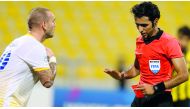 Wesley Sneidjer (left) and referee Abdull Ali Athba in this file picture of November 8.