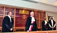 Lord Thomas of Cwmgiedd (second left) swearing in as the new President of QICDRC