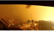 Helicopter pilots look for a landing spot during a rescue made on the fly during the Woolsey Fire in Malibu, California, in this November 9, 2018 still image taken from helmet camera footage by LAFD David Nordquist. LAFD/David Nordquist/Social Media/via R