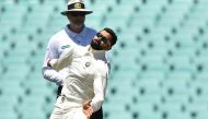 India's captain Virat Kohli bowls to Australia's Harry Nielsen on the fourth day of the tour match against Cricket Australia XI at the SCG in Sydney on December 1, 2018. AFP / PETER PARKS 