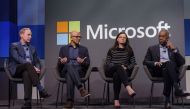Microsoft CEO Satya Nadella, second from left, answers a shareholders question while President Brad Smith, CFO Amy Hood and Board Chairman John Thompson listen during the Microsoft Annual Shareholders Meeting at the Meydenbauer Center on November 28, 2018