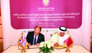 H E Ali bin Ahmed Al Kuwari (right), Minister of Commerce and Industry, and George Hollingbery, the UK’s Minister of State for Trade Policy, signing the minutes.