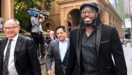 West Indies cricketer Chris Gayle reacts as he leaves the New South Wales Supreme Court after winning a defamation case against an Australian media company in Sydney, Australia, October 30, 2017. AAP/Brendan Esposito/via REUTERS 
