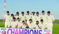 New Zealand cricketers pose with the winner's trophy following the third and final Test cricket match between Pakistan and New Zealand at the Sheikh Zayed International Cricket Stadium in Abu Dhabi on December 7, 2018.  AFP / Aamir Qureshi 
