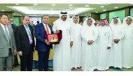 Qatar Chamber First Vice-President Mohammed bin Ahmed bin Towar, along with other chamber officials, presenting a memento to the head of the visiting Indonesian delegation, yesterday.