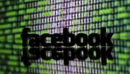 A 3D printed Facebook logo is seen in front of displayed cyber code in this illustration taken March 22, 2016. Reuters/Dado Ruvic 