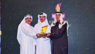 Khalid Alnaama, Head of Public Sector Unit, Doha Bank, receiving the award on behalf of Doha Bank from QSE Marketing & Communications Director Hussain Mohammed Al Abdullah at the ceremony held in Doha. 