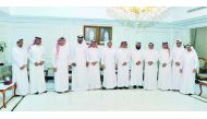 Officials of Qatar Chamber and the Ministry of Administrative Development, Labour and Social Affairs (MADLSA) pose for a group picture.