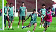 Bayern Munich midfielder Thiago Alcantara (left) takes part in a training session during their winter training camp in Doha yesterday.