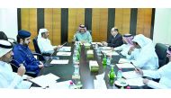 Ali bin Abdul Latif Al Misnad (centre), member of the Board of Directors, Qatar Chamber, and Chairman of the Services Committee, presiding the meeting at QC headquarters, yesterday. 