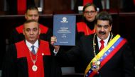 Venezuela's President Nicolas Maduro is sworn in by Venezuela's Supreme Court President Maikel Moreno, during the ceremonial swearing-in for his second presidential term, at the Supreme Court in Caracas, Venezuela January 10, 2019. Reuters/Carlos Garcia R