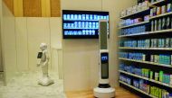 Pepper of SoftBank Robotics (L) and Tally of Simbe Robotics (R) are teaming up to work with retailers: Pepper interacts with customers while Tally scans the shelves to monitor inventory levels in this demo from SoftBank at the Consumer Electronics Show in