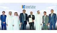 Dr R Seetharaman, Group CEO (fifth left), Doha Bank, and other senior officials with the award.