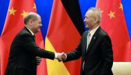 German Finance Minister Olaf Scholz shakes hands with Chinese Vice Premier Liu He after attending a signing ceremony for the China-Germany High Level Financial Dialogue at the Diaoyutai State Guesthouse in Beijing, China, January 18, 2019. Andy Wong/Pool 