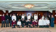 QIIB Chief Executive Officer Dr Abdulbasit Ahmad Al Shaibei and other bank officials with the visiting Qatar Academy students.