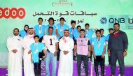 Young riders pose with the officials after taking part in the 20km Endurance Race which was held at Sealine on Friday. 
