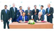 Adeeb Ahamed (sitting left), Managing Director, Twenty14 Holdings signing the agreement with Necron AG CEO Gerard van Liempt to develop the IntercityHotel Zurich Airport, in the presence of Yusuff Ali MA, Chairman and Managing Director, LuLu Group Interna