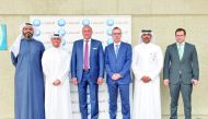 Bassel Gamal (third left), QIB Group’s CEO; and other QIB senior executives on the sidelines of the event.
