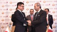 H E Ali bin Ahmed Al Kuwari (centre), Minister of Commerce and Industry, during the signing of an agreement between Qatari and Japanese businessmen, on the sidelines of Qatar-Japan Business Forum held in Tokyo, yesterday.