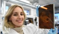 Polish physicist and businesswoman Olga Malinkiewicz poses with a printed solar panel at her company Saule in Wroclaw on January 16, 2019. AFP / Janek SKARZYNSKI