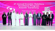 Rashid bin Ali Al Mansoori (sixth left), CEO of Qatar Stock Exchange, with the award winners at the annual award ceremony event. Pic: Abdul Basit / The Peninsula