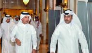H E Ali Shareef Al Emadi, Chairman of the Board of Directors of QNB Group, who is also the Minister of Finance, being led by Abdulla Mubarak Al Khalifa (right), Acting Group CEO of QNB, to preside over the QNB Group’s Ordinary and Extraordinary General As