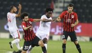 Al Rayyan’s Ahmad Mohamed Al Sayyid (second left) vies for the ball with Al Arabi’s Wilfried Bony during their QNB Stars League match played at the Al Sadd Stadium, yesterday.