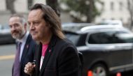 T-Mobile CEO John Legere (R) leaves after a hearing before the Communications and Technology Subcommittee of the House Energy and Commerce Committee February 13, 2019 on Capitol Hill in Washington, DC.  Alex Wong/Getty Images/AFP