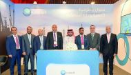 QIB’s Group CEO Bassel Gamal and senior executives at the bank’s pavilion put-up at Tawteen Exhibition & Conference, yesterday.