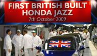 (FILES) This file photo taken on October 7, 2009, shows workers waiting for the launch of the first British built Honda Jazz family supermini to leave the production line at the Honda car plant in Swindon. AFP / MAX NASH