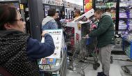 People wait in line pay at a Walmart during a sales event on Thanksgiving day in Westbury, New York, U.S., November 22, 2018. Reuters/Shannon Stapleton