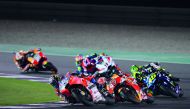 Andrea Dovizioso (left) is closely followed by Marc Marquez and Valentino Rossi in action during the Grand Prix of Qatar at the Losail International Circuit in this file photo.