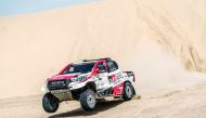 Qatar’s Nasser Saleh Al Attiyah and his French navigator  Matthieu Baumel driving their Toyota Hilux during the second selective section of the Manateq Qatar Cross-Country Rally, yesterday.
