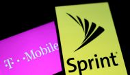 Smartphones with the logos of T-Mobile and Sprint are seen in this illustration taken on September 19, 2017. Reuters/Dado Ruvic