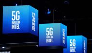 5G signs are displayed at the Intel stand at the Mobile World Congress (MWC) in Barcelona on February 25, 2019.  AFP / Josep Lago 
