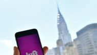 Lyft transport application is seen on a smartphone in New York City in this file photo taken on June 29, 2018.  AFP / Angela Weiss
 