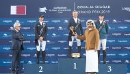 Qatar Olympic Committee President, H E Sheikh Joaan bin Hamad Al Thani presents the winners’ trophy to Longines Global Champions Tour - Doha Grand Prix winner Julien Epaillard at the Al Shaqab Arena, yesterday.