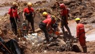 Members of a rescue team search for victims after a tailings dam owned by Brazilian mining company Vale SA collapsed, in Brumadinho, Brazil January 28, 2019. Reuters/Adriano Machado