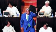 Sri Lankan Finance Minister Mangala Samaraweera shows a briefcase containg the 2019 budget proposals as he arrives at parliament in Colombo, March 5, 2019. Reuters/Dinuka Liyanawatte