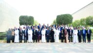 Total Research Center – Qatar (TRC-Q) officials pose for a photo during the event.