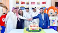 Moutaz Al Khayyat, Group Chairman, Power International Holding; Ali Kazma, Chairman, Kidz Holding; and Dr Abdulbasit Ahmad Al Shaibei, QIIB Chief Executive Officer; along with other guests cutting the ceremonial cake. 