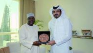 The President of Qatar Olympic Committee, H E Sheikh Joaan bin Hamad Al Thani presenting a memento to the President of the Confederation of African Athletics, Colonel Kalkaba Malboum, during a meeting held in Doha, yesterday.