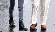 US President Donald Trump and first lady Melania Trump wear boots as they head out together to tour hurricane damage in Florida from White House, October 15, 2018. Reuters/Jonathan Ernst