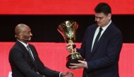 Former NBA star Yao Ming (R) is presented with a trophy by former NBA star Kobe Bryant during the draw ceremony for the 2019 FIBA Basketball World Cup, in Shenzhen, in China's southern Guangdong province on March 16, 2019.  China OUT / AFP / STR