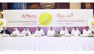 Sheikh Thani bin Thamer bin Mohamed Al Thani, Chairman of Al Meera Board of Directors; Dr Saif Said Al Sowaidi, Vice-Chairman; H E Dr Saleh bin Mohammad Al Nabit, Board member; and other officials during the Ordinary General Assembly meeting of Al Meera, 