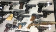 File photo of weapons the government says were seized from militants in Xinjiang are on display at an exhibition titled 